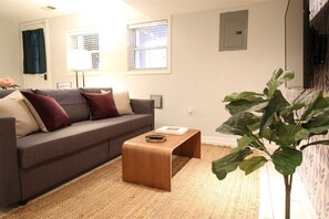 Sofa in the living room pulls out to accommodate 2 additional guests