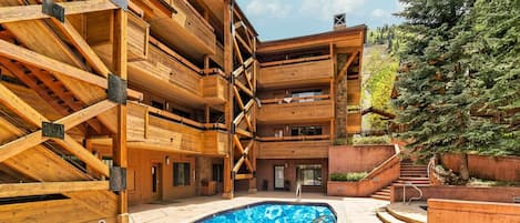 The pool area at Fasching Haus is open in the summer and winter months and offers a view of Aspen Mountain.