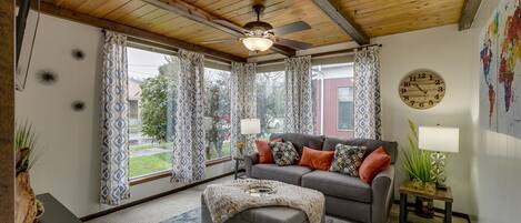 Living Room with pullout full sized sleeper sofa and single sleeper ottoman