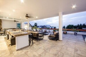 Rooftop terrace has a kitchen with BBQ grill, refrigerator and wine cooler