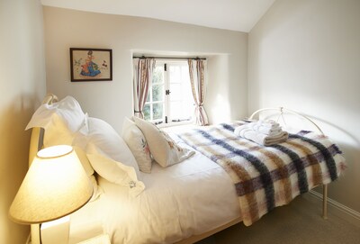 Memorial Cottage is a Grade II listed, period stone, terraced holiday cottage