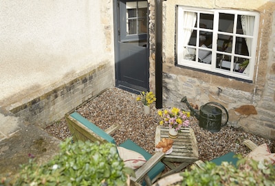 Memorial Cottage is a Grade II listed, period stone, terraced holiday cottage