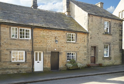 Memorial Cottage is a Grade II listed, period stone, terraced holiday cottage