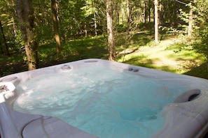 Guests can enjoy the quiet surroundings while soaking in the outdoor hot tub.