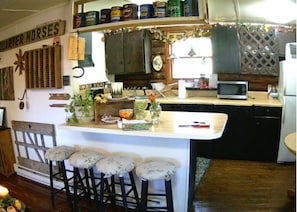 Fully equipped kitchen with breakfast bar. 