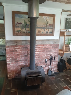 Cozy up around the wood stove. Unlimited fire wood provided by the Ranch.