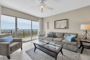 Living Room with "WALL OF WINDOWS" for beautiful views of the sand dunes and the gulf. Pull out Queen sofa.