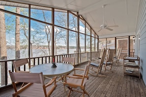 Large screened in porch with terrific views of the lake and outside dining area