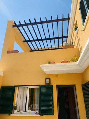 Entrance View. Downstairs terrace and Upstairs terrace.