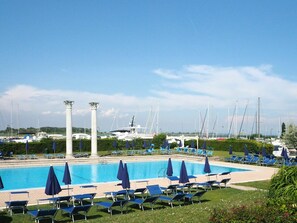 Water, Sky, Plant, Cloud, Swimming Pool, Azure, Outdoor Furniture, Body Of Water, Sunlounger, Tree