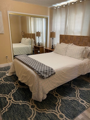 Bedroom with queen bed. Duvet cover may be different at your stay 