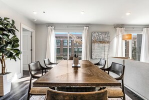 Open concept living, kitchen, and dining with ample seating. 58” Samsung Smart 4K TV for streaming and DIRECTV Entertainment. Relax on the sofa or cozy chairs after a day in NOLA! Dining for six, plus four at the bar. Plenty of natural light!