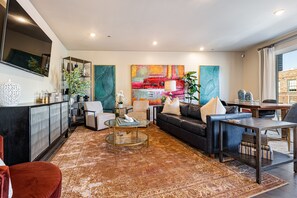 Open concept living, kitchen, and dining area with ample comfortable seating options for you and your guests. 65” Samsung Smart 4K TV that allows for streaming from your favorite apps, along with the DIRECTV Entertainment. Lounge on the sofa and cozy chairs after an activity filled day in NOLA! Dining table with seating for four and bar dining with seating for four. All the natural light too!