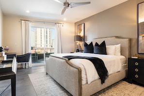 Spacious master bedroom featuring a king size bed with an ensuite bathroom and designer built in closets. The bedroom is equipped with night stands, lamps, hangers, luggage racks, alarm clock, white noise machine and a 50'' Samsung Smart 4K TV that allows for streaming from your favorite apps, along with the DIRECTV Entertainment.