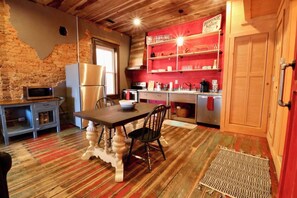 Whether on the go or staying inside for the day, pack a picnic basket or groceries along for the trip and enjoy your own freshly prepared meals in our vintage inspired kitchen complete with stainless steel microwave, stove, dishwasher, refrigerator and Keu