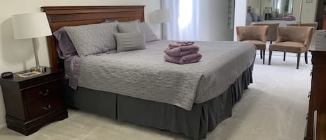 Master Bedroom with king size bed. Skylights fill the room with natural light.