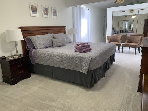 Master Bedroom with king size bed. Skylights fill the room with natural light.