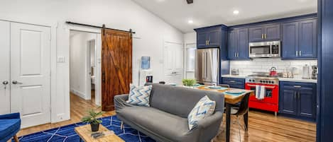 Open concept floor plan with 11 foot ceilings and barn door.