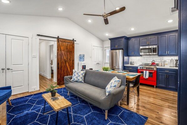 Open concept floor plan with 11 foot ceilings and barn door.