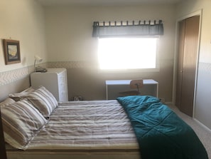 Bedroom 1 with full size bed and desk area