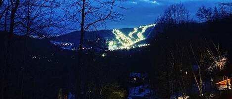 Photo taken by guest February 2021 of the ski slopes lit up at night from our balcony.