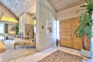 Entry features double doors and travertine marble flooring