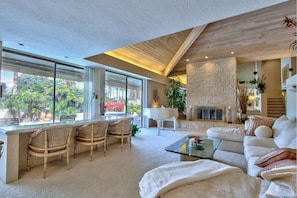 Living Room features sunken wet bar with granite countertop and ice maker