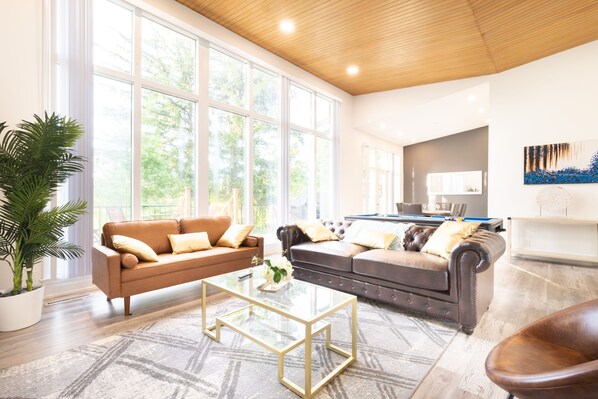 Living room with floor to ceiling windows