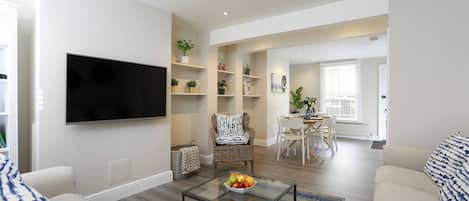 Open plan sitting room and dining area.