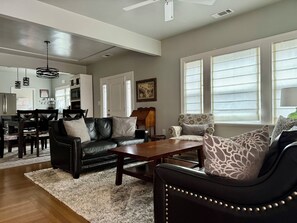 Well lit living room view from entry.