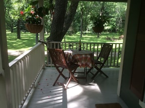 The front porch is a great place to enjoy a meal or a glass of wine.