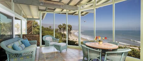 Dreamy sunroom with expansive coastal views