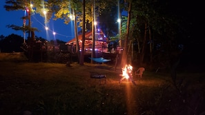 View from the campfire by the river of the bar/deck area