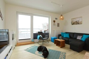 Cosy Living room with 55 inch Smart TV , fireplace and dining room
