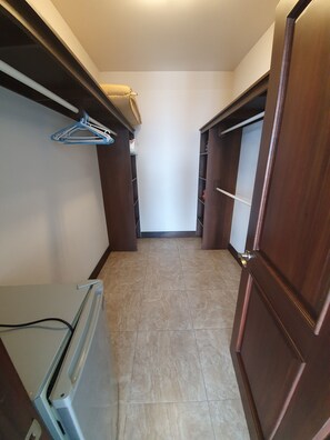 Large walk in closets with beach towels, safe, mini fridge and extra pillows.