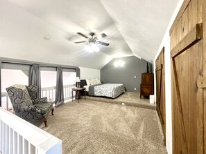 upstairs bedroom has lots of space & vaulted ceiling