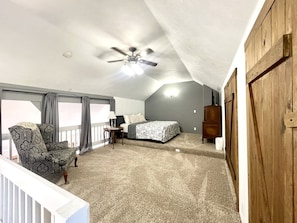 upstairs bedroom has lots of space & vaulted ceiling