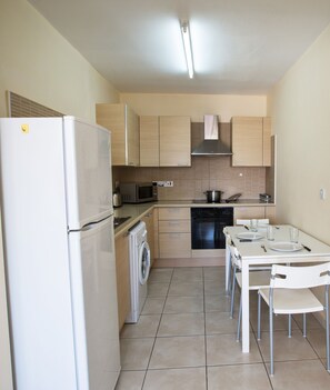 Fully Equipped kitchen with dining area