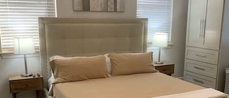 Master bedroom with King  upholstered platform bed, 12” memory foam mattress!
