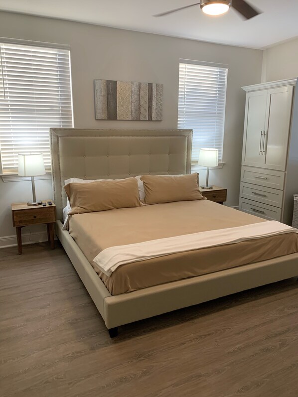 Master bedroom with King  upholstered platform bed, 12” memory foam mattress!