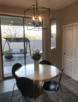 Dining for 16 with nook, island, bar and back patio. 