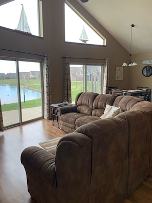 View of patio and pond from living area