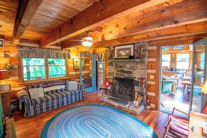 Fireplace with couch and rockers...