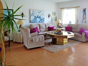 Living Room, Room, Furniture, Interior Design, Floor, Property, Coffee Table, Laminate Flooring, Purple, Table
