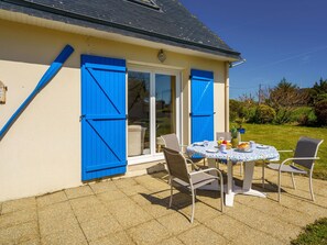 Building, Property, Furniture, Window, Plant, Table, Azure, Shade, Chair, Door
