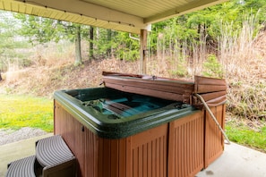 A third outdoor seating option next to the hottub offers complete seclusion.