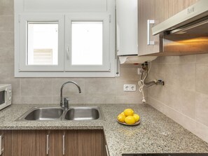 Countertop, Kitchen, Kitchen Appliance, Major Appliance, Cabinetry, Kitchen Sink, Interior Design, Sink, Flooring, Plumbing Fixture