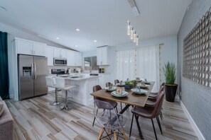 Open concept kitchen and dining room with all the basic cooking essentials.