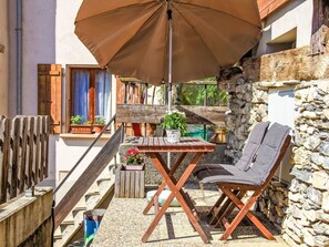 Furniture, Table, Plant, Building, Outdoor Table, Umbrella, Wood, Shade, Outdoor Furniture, Chair