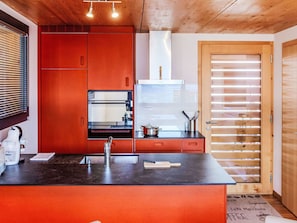 Property, Cabinetry, Furniture, Building, Countertop, Kitchen, Interior Design, Orange, Wood, Window